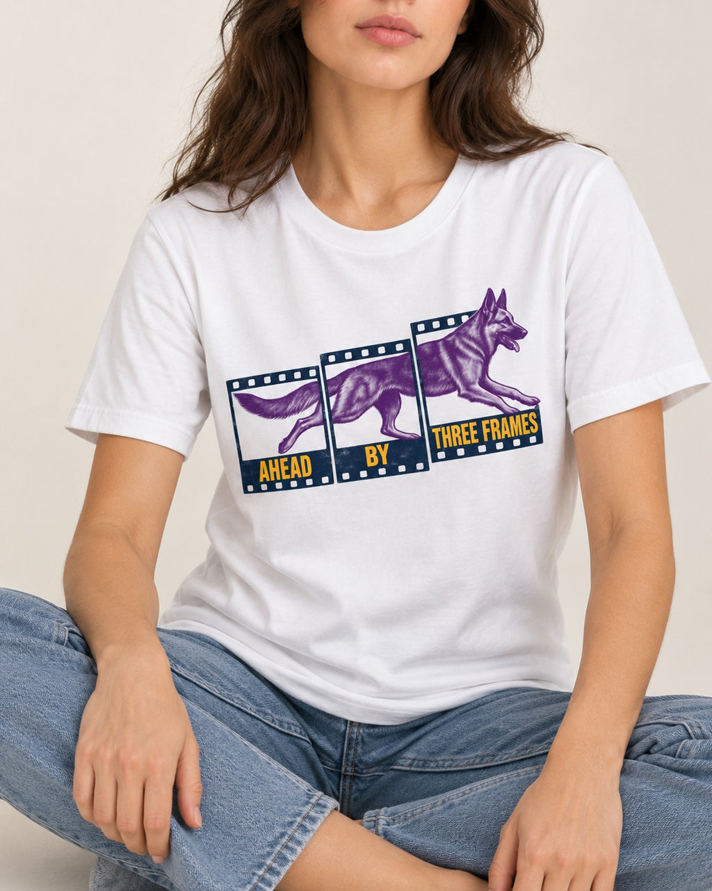 German Shepherd Dog Ahead by Three Frames T-Shirt in White, worn by a seated model