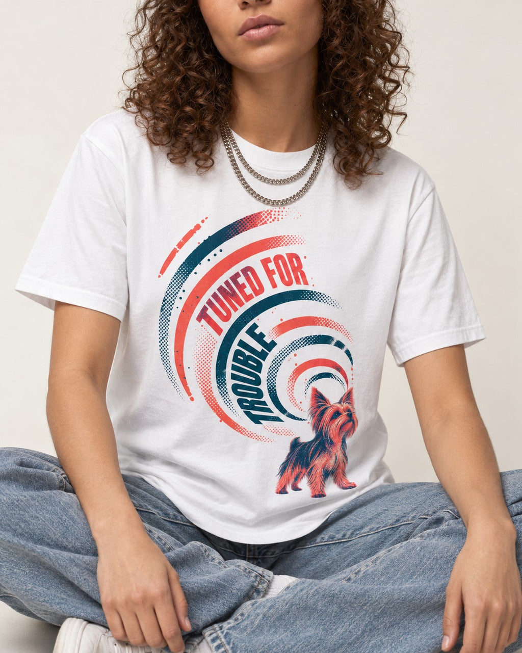 Yorkshire Terrier Tuned for Trouble T-Shirt in White, worn by a seated model