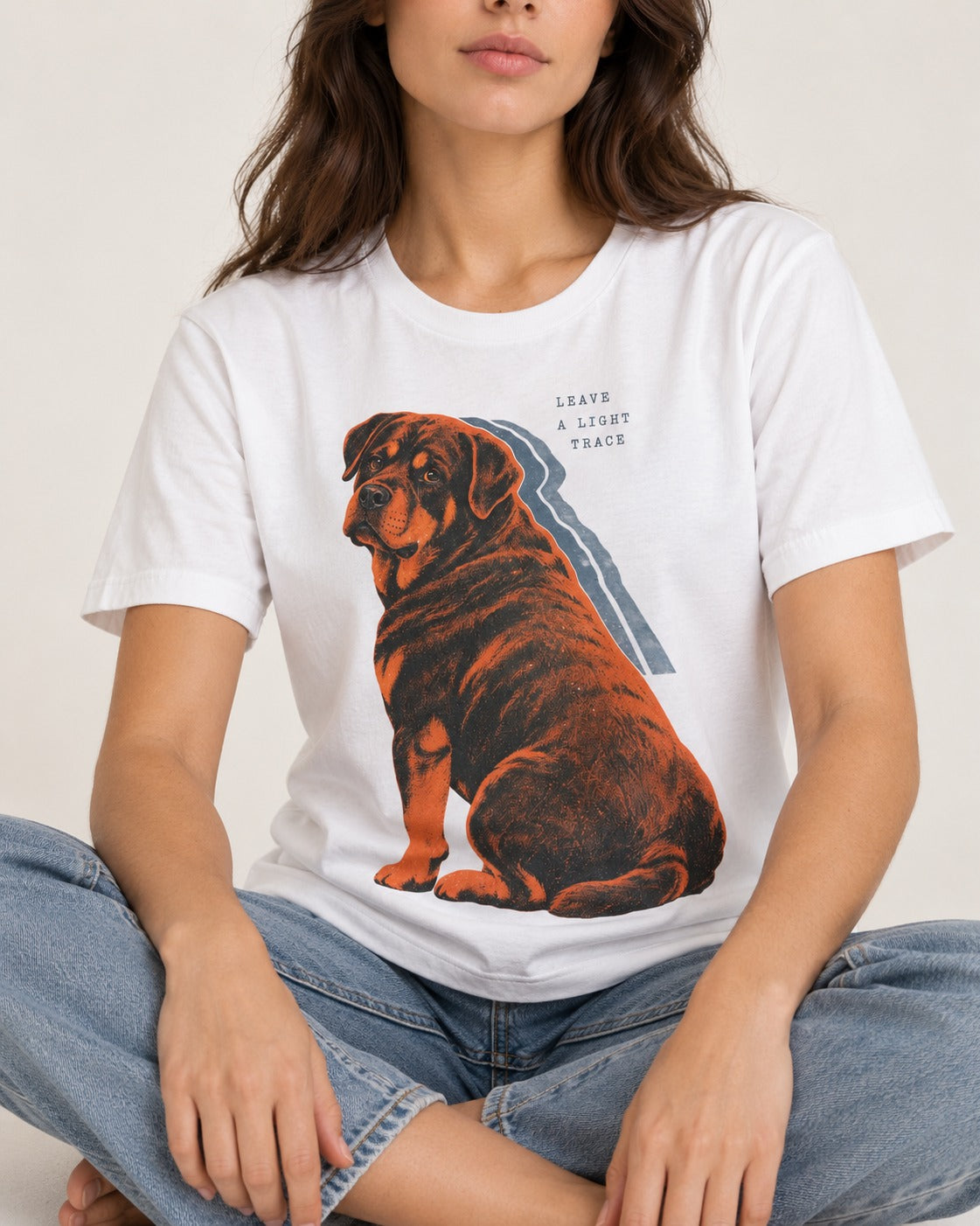Rottweiler Leave a Light Trace T-Shirt in White, worn by a seated model