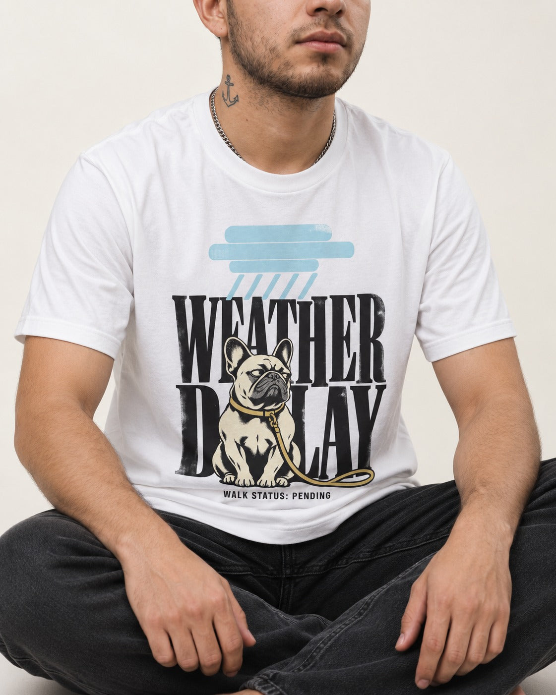 Frenchie Weather Delay T-Shirt in White, worn by a seated model