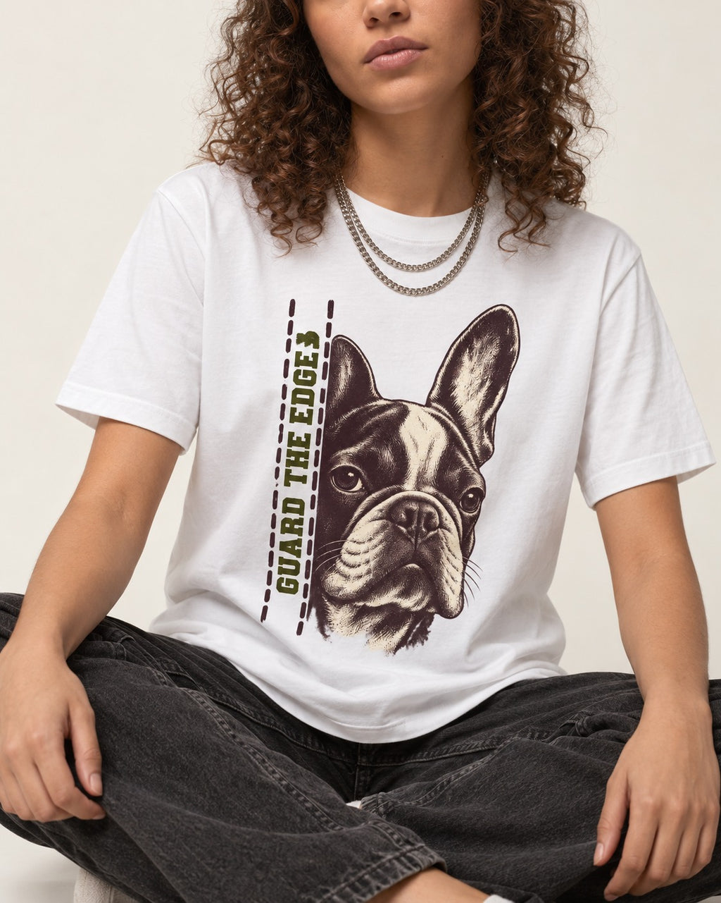 Frenchie Guard the Edge T-Shirt in White, worn by a seated model