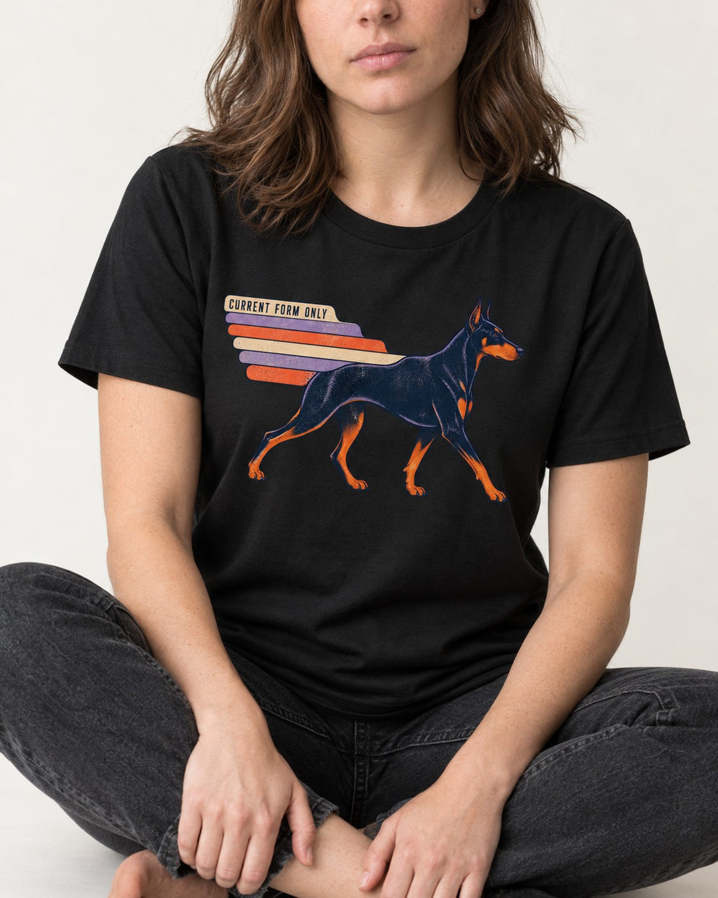 Doberman Current Form Only Speed Bars Graphic T-Shirt in Black, worn by a seated model