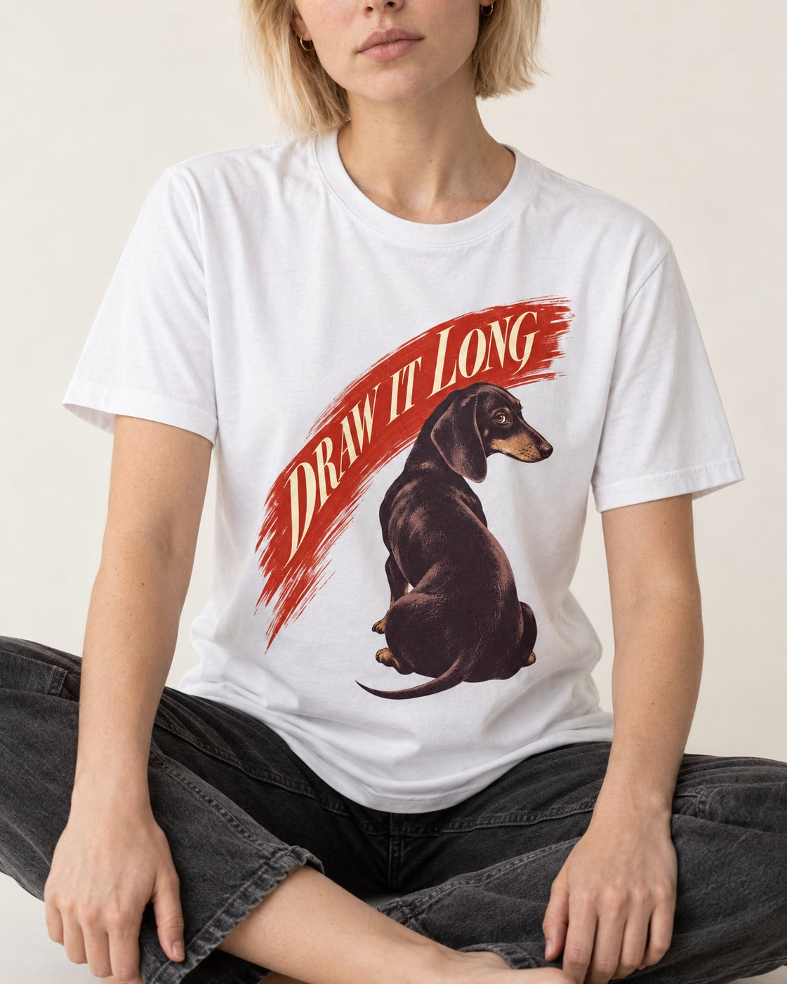 Draw It Long Dachshund T-Shirt in White, worn by a seated model