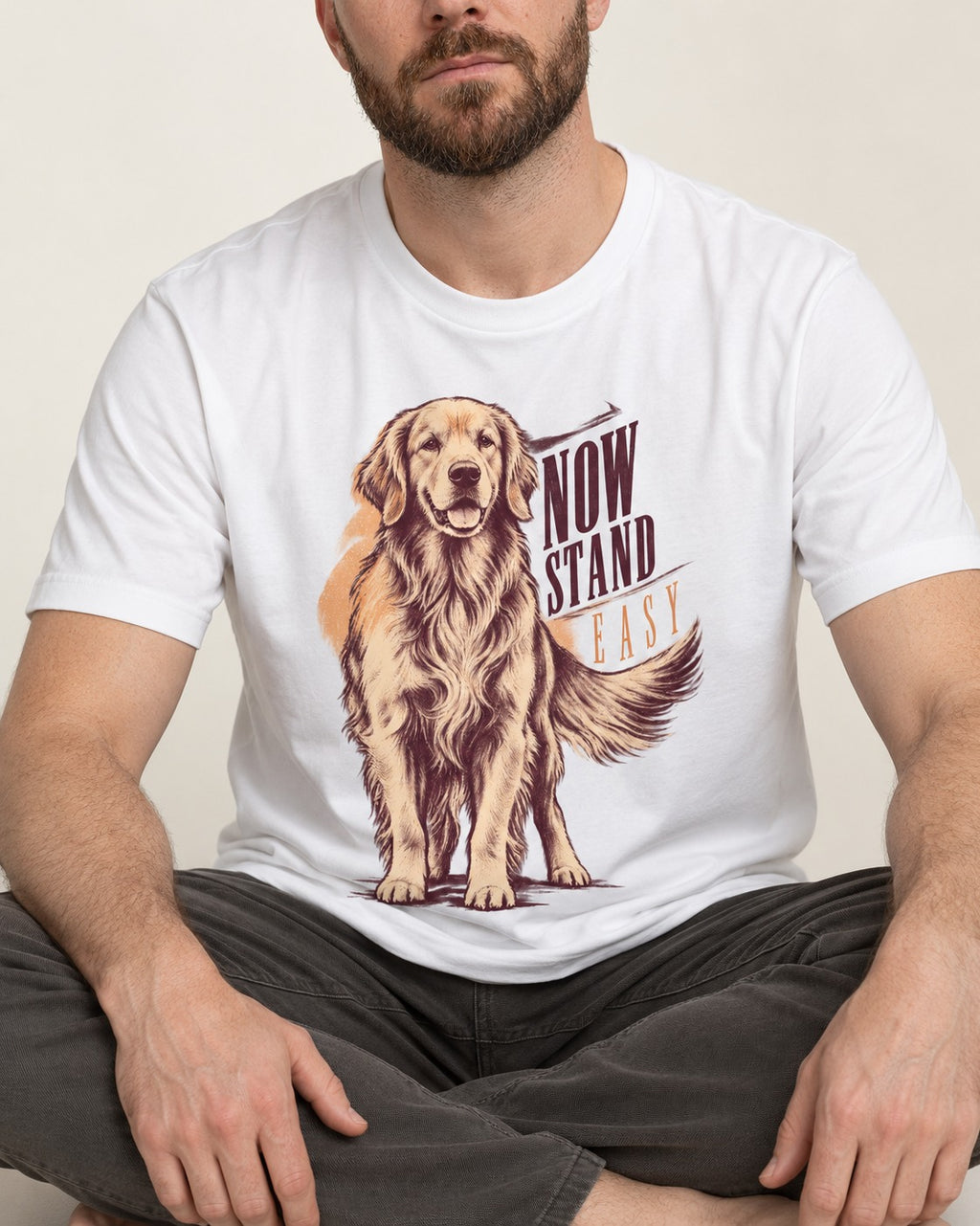 Now Stand Easy Golden Retriever T-Shirt in White, worn by a seated model