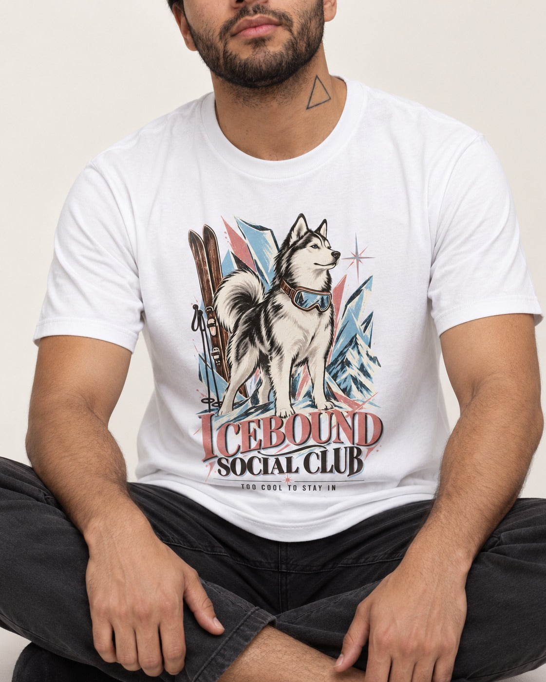 Icebound Husky T-Shirt in White, worn by a seated model