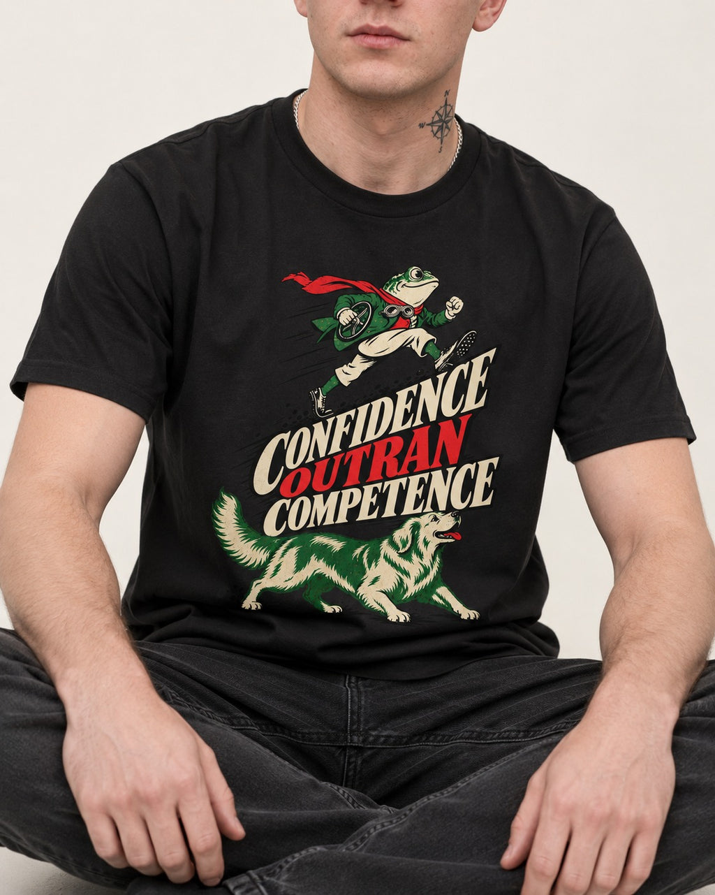 Golden Retriever Confidence Outran Competence Racing Graphic T-Shirt in Black, worn by a seated model