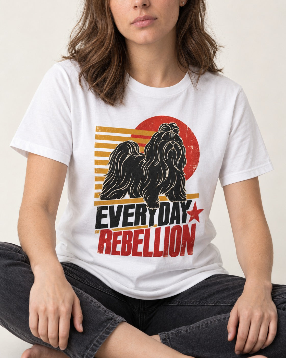 Everyday Rebellion Shih Tzu T-Shirt in White, worn by a seated model