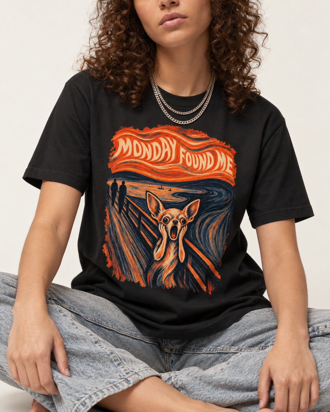Monday Found Me Chihuahua Scream Banner T-Shirt in Black, worn by a seated model