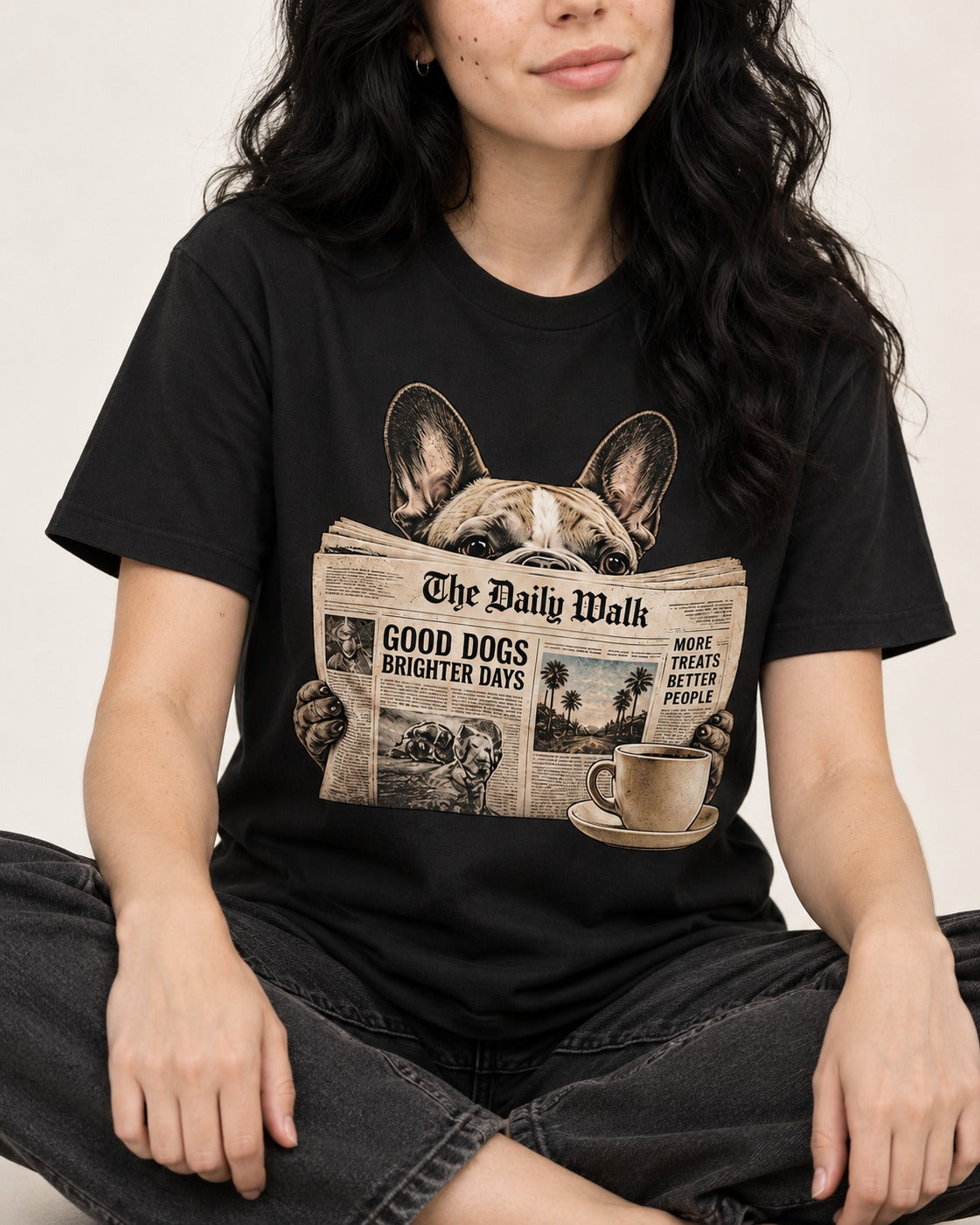 Frenchie Good Dogs Brighter Days Newspaper Graphic T-Shirt in Black, worn by a seated model