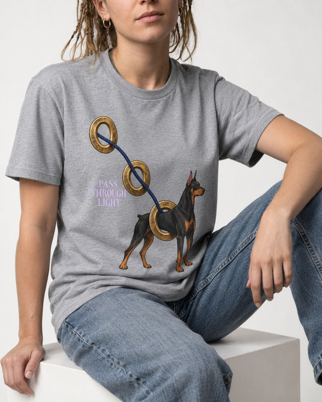 Doberman Pass Through Light Ring Graphic T-Shirt in Sport Grey, worn by a seated model
