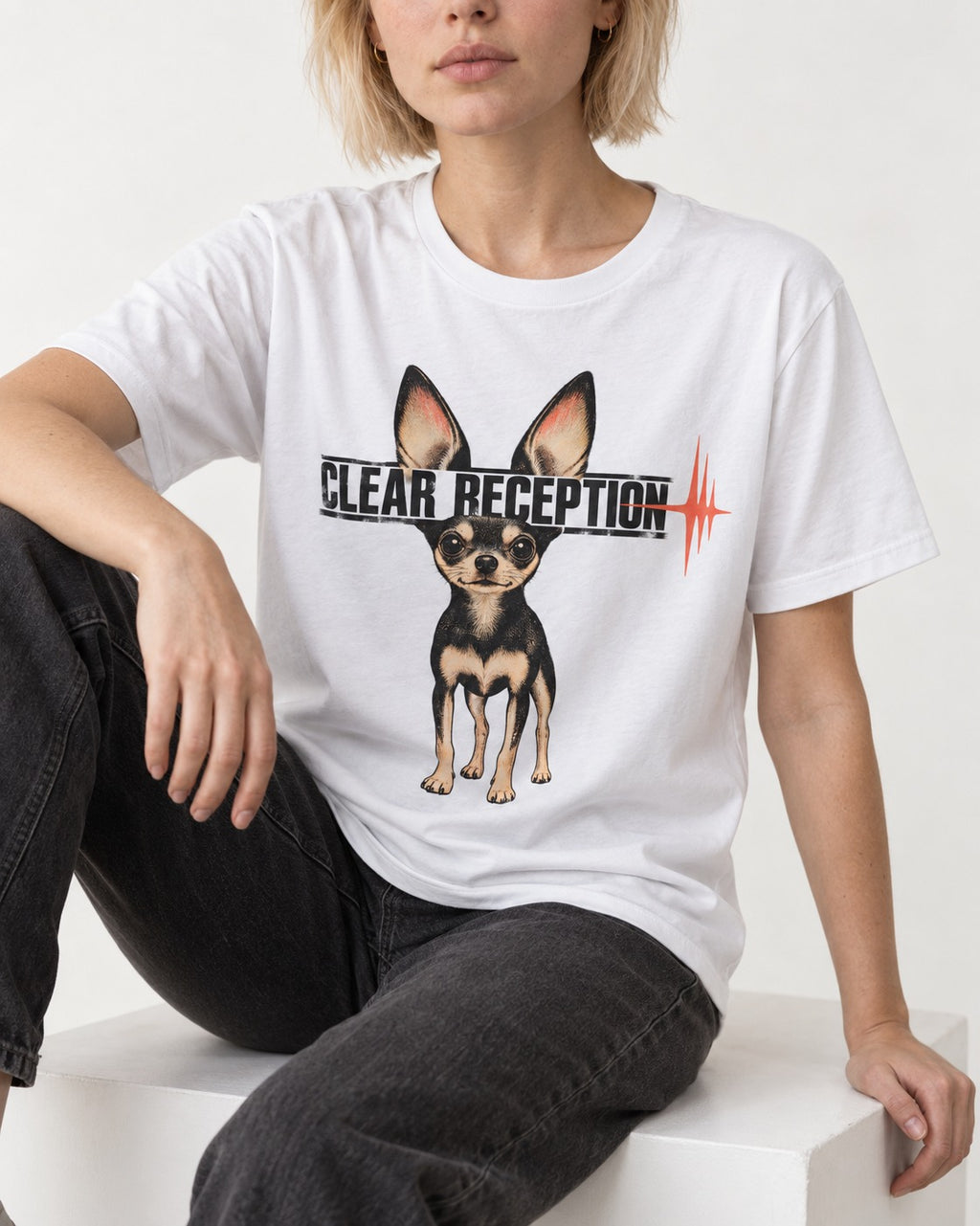 Chihuahua Clear Reception T-Shirt in White, worn by a seated model