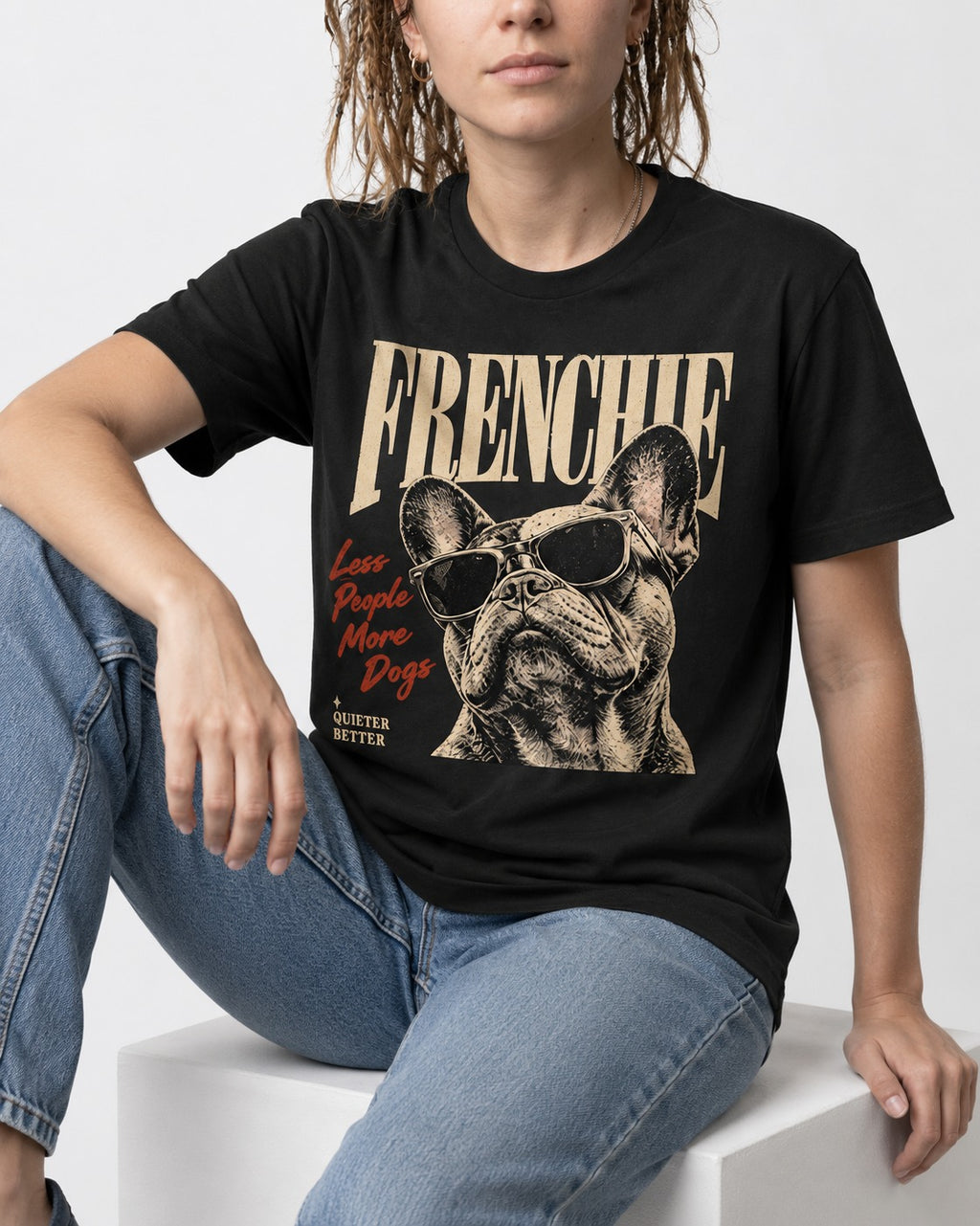 Frenchie Less People More Dogs Sunglasses Graphic T-Shirt in Black, worn by a seated model