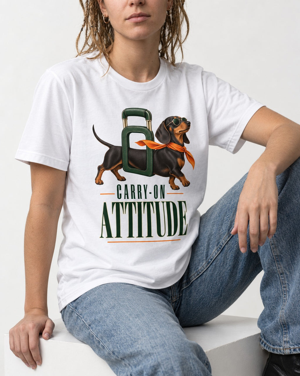 Dachshund Carry on Attitude T-Shirt in White, worn by a seated model