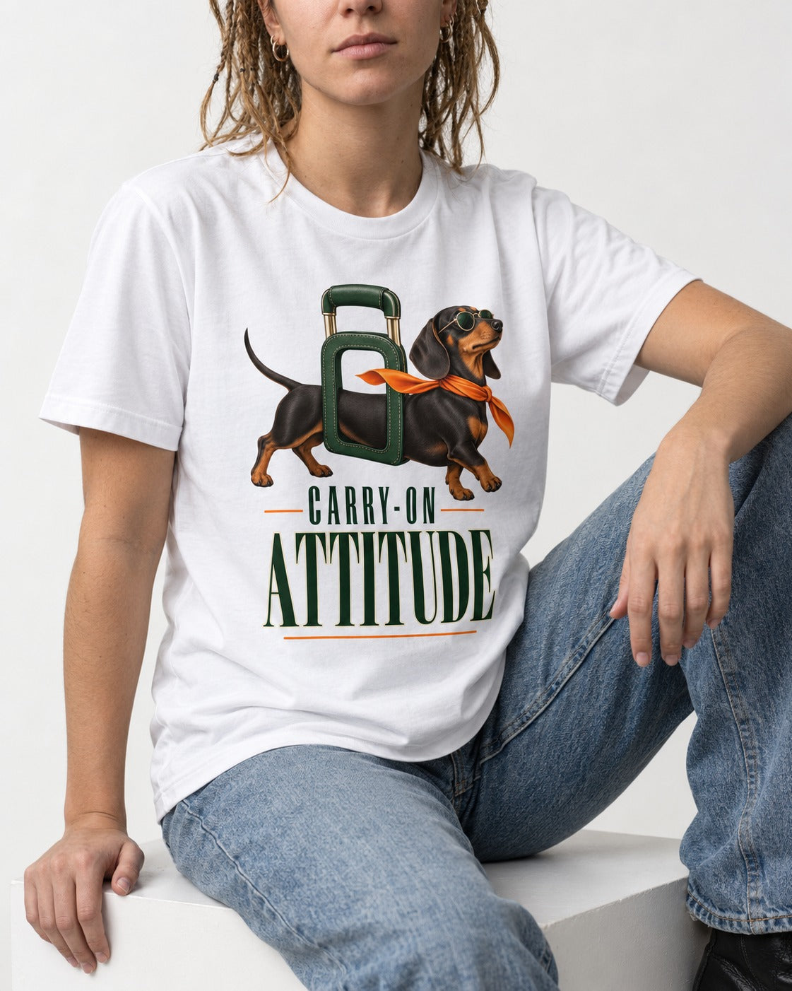 Dachshund Carry on Attitude T-Shirt in White, worn by a seated model