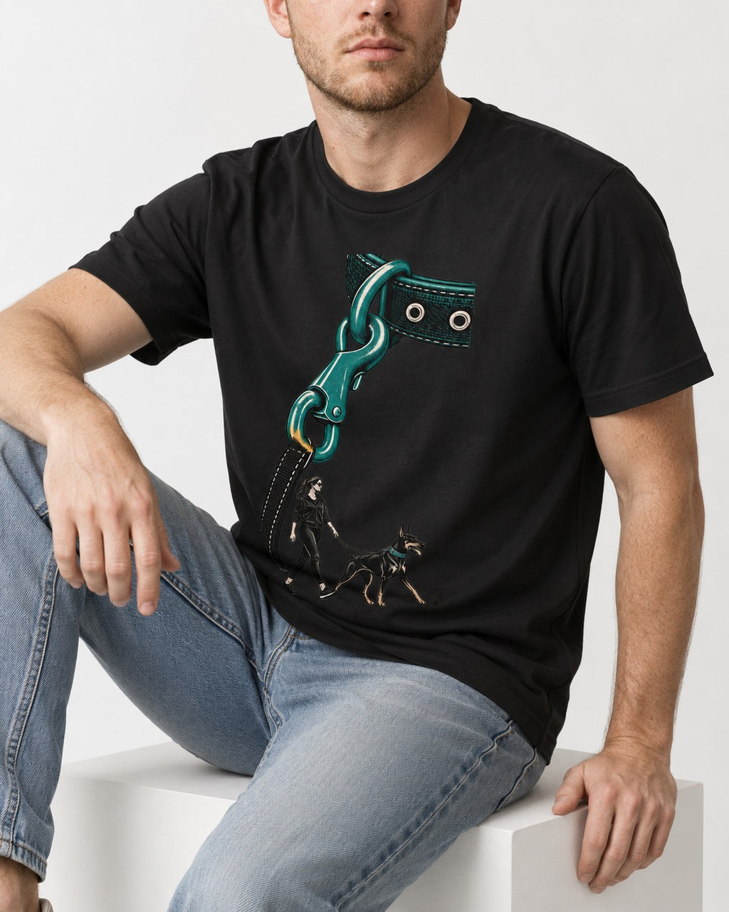 Doberman Oversized Leash Hardware Walk Graphic T-Shirt in Black, worn by a seated model