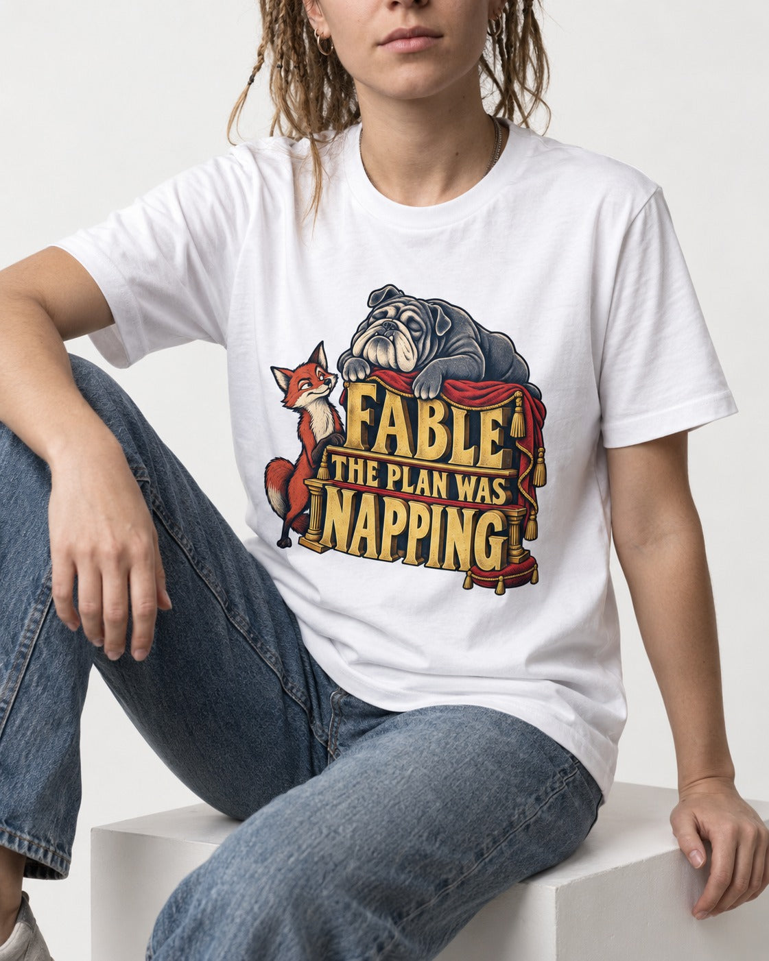 English Bulldog The Plan Was Napping T-Shirt in White, worn by a seated model