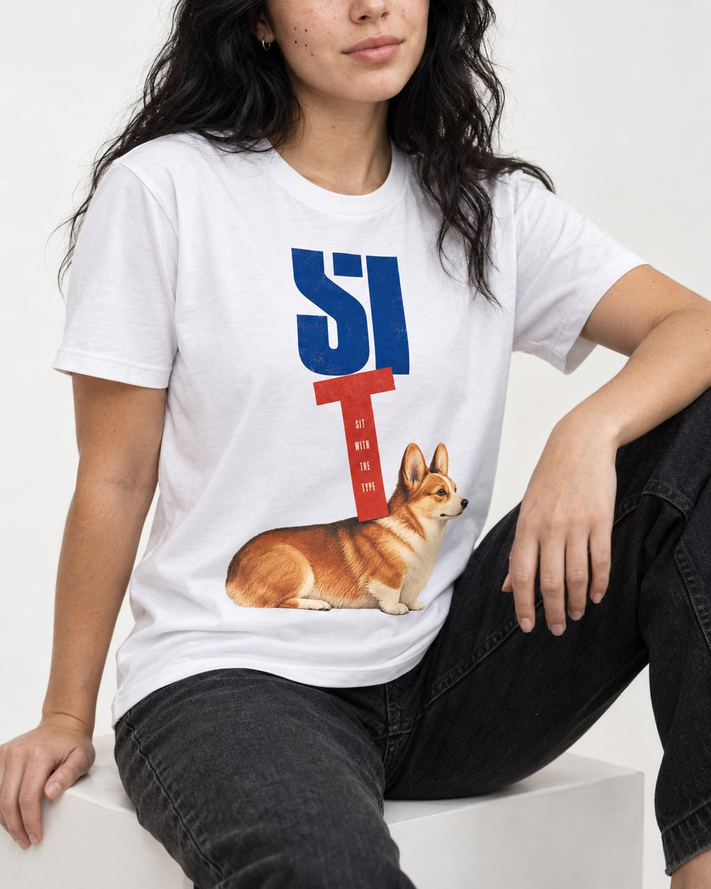 Sit with the Corgi T-Shirt in White, worn by a seated model