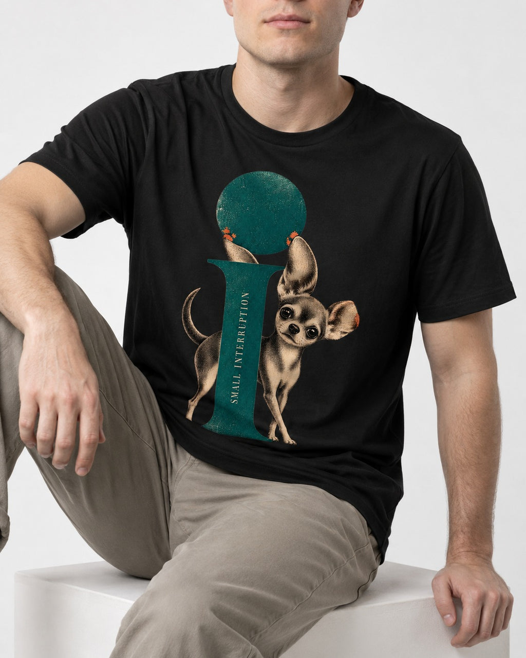 Chihuahua Small Interruption Geometric Portrait T-Shirt in Black, worn by a seated model