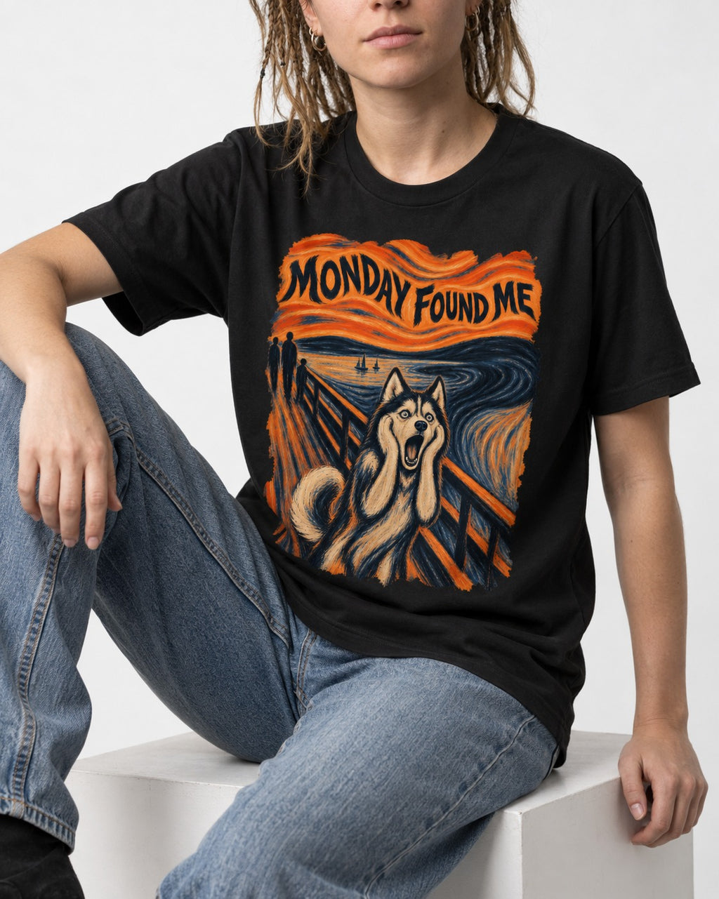 Husky Monday Found Me Scream Parody Graphic T-Shirt in Black, worn by a seated model