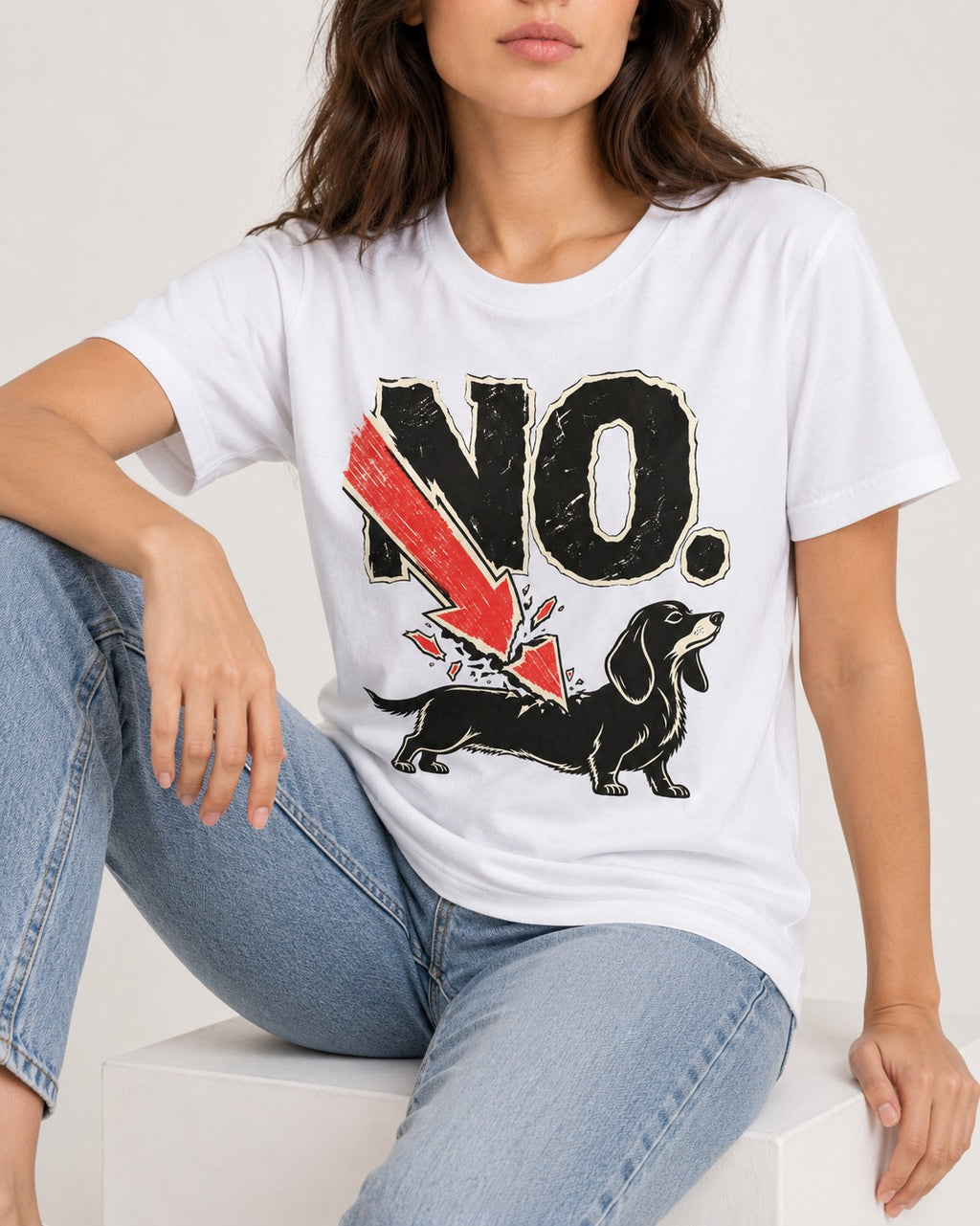 Dachshund Says No T-Shirt in White, worn by a seated model