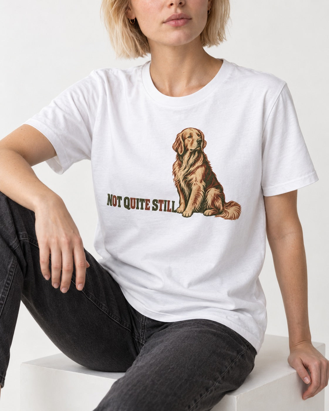 Golden Retriever Not Quite Still T-Shirt in White, worn by a seated model