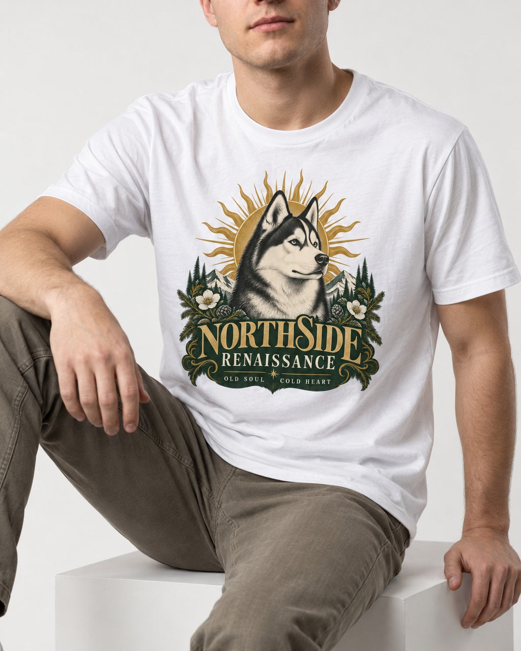 Northside Renaissance Husky T-Shirt in White, worn by a seated model