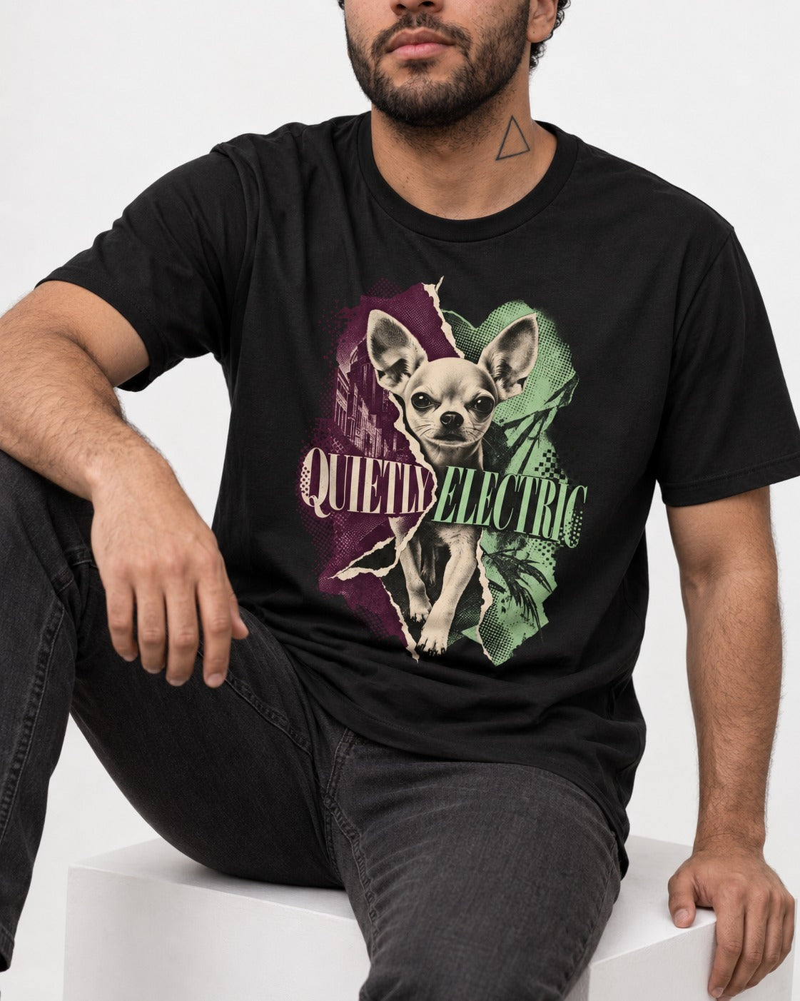 Chihuahua Quietly Electric T-Shirt in Black, worn by a seated model