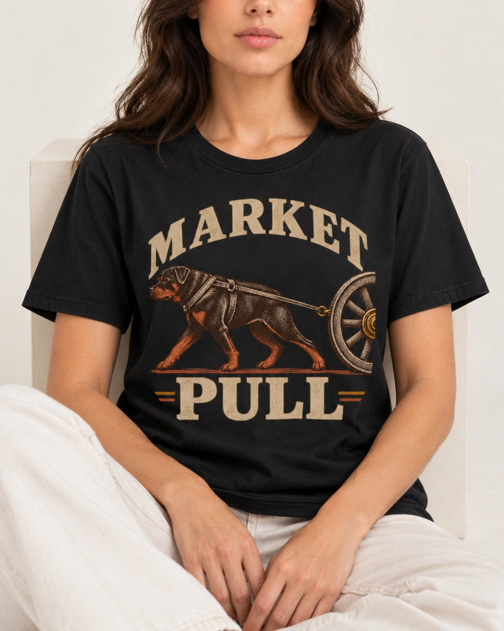 Market Pull Rottweiler Cart Harness Graphic T-Shirt in Black, worn by a seated model