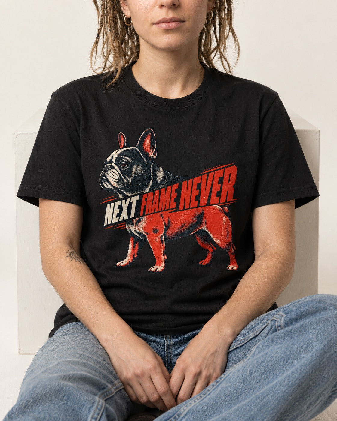 Frenchie Next Frame Never Motion Banner Graphic T-Shirt in Black, worn by a seated model