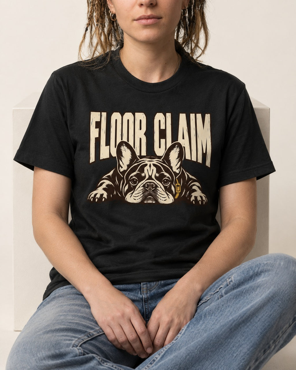Frenchie Floor Claim Resting Graphic T-Shirt in Black, worn by a seated model