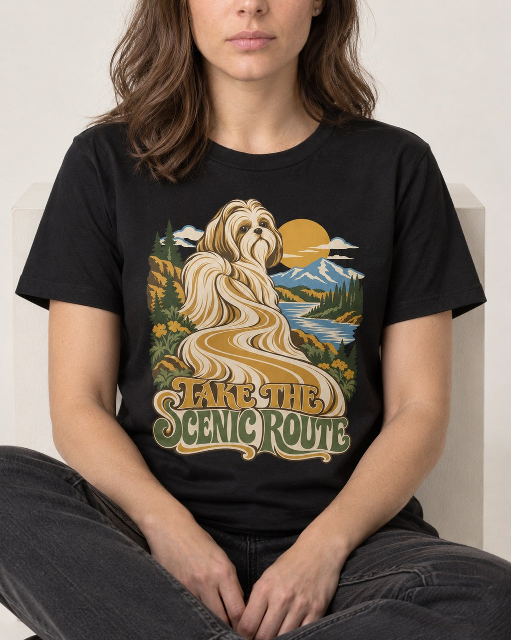 Shih Tzu Take the Scenic Route Mountain Vista Graphic T-Shirt in Black, worn by a seated model