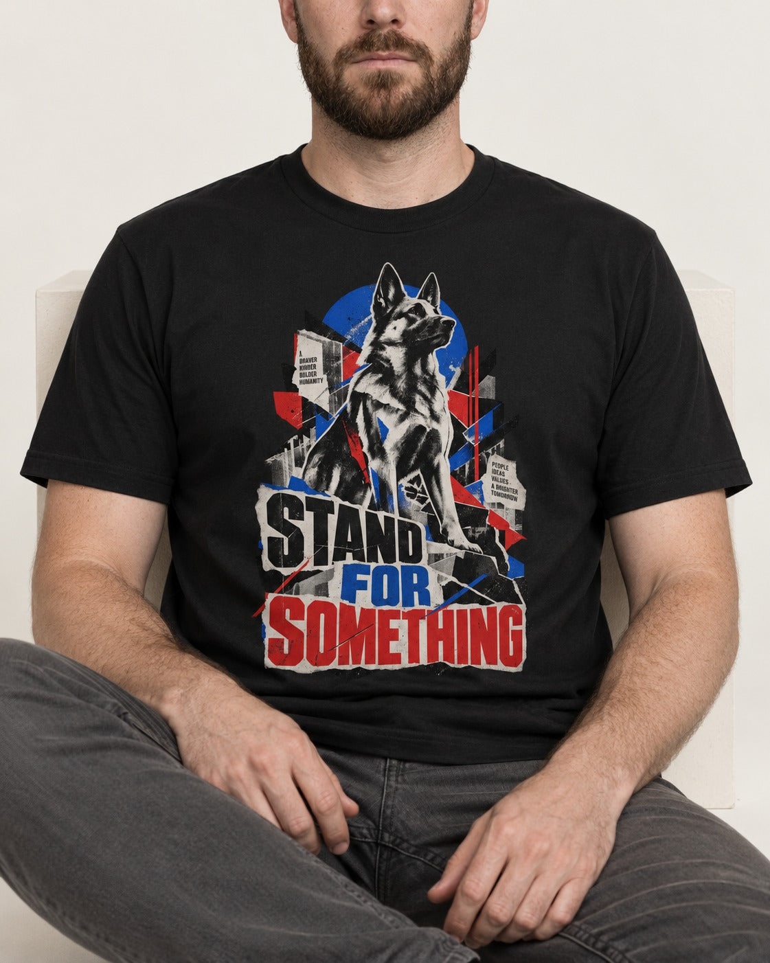 Stand For Something Brutalist Collage German Shepherd Dog Graphic T-Shirt in Black, worn by a seated model