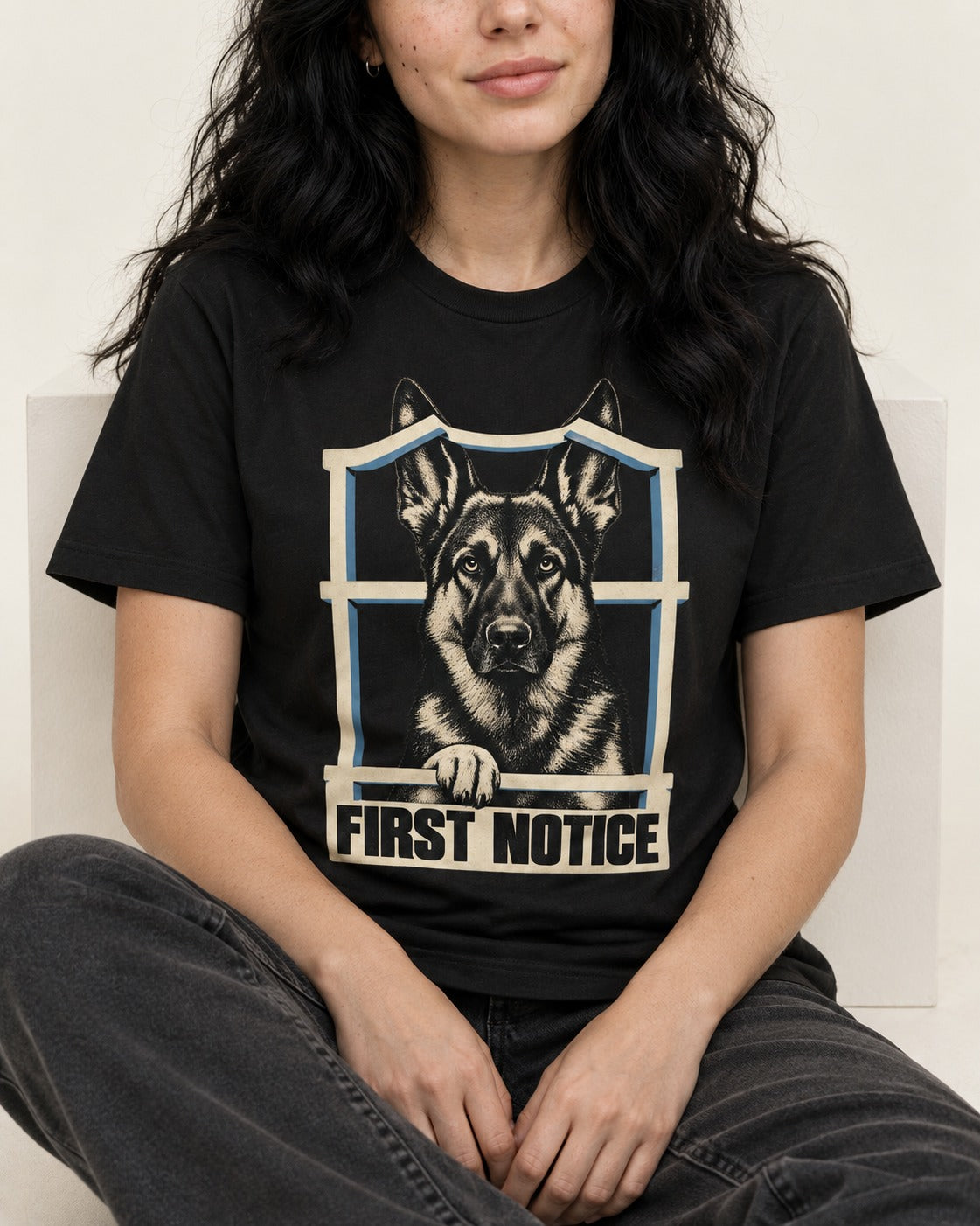 First Notice Window German Shepherd Dog Graphic T-Shirt in Black, worn by a seated model
