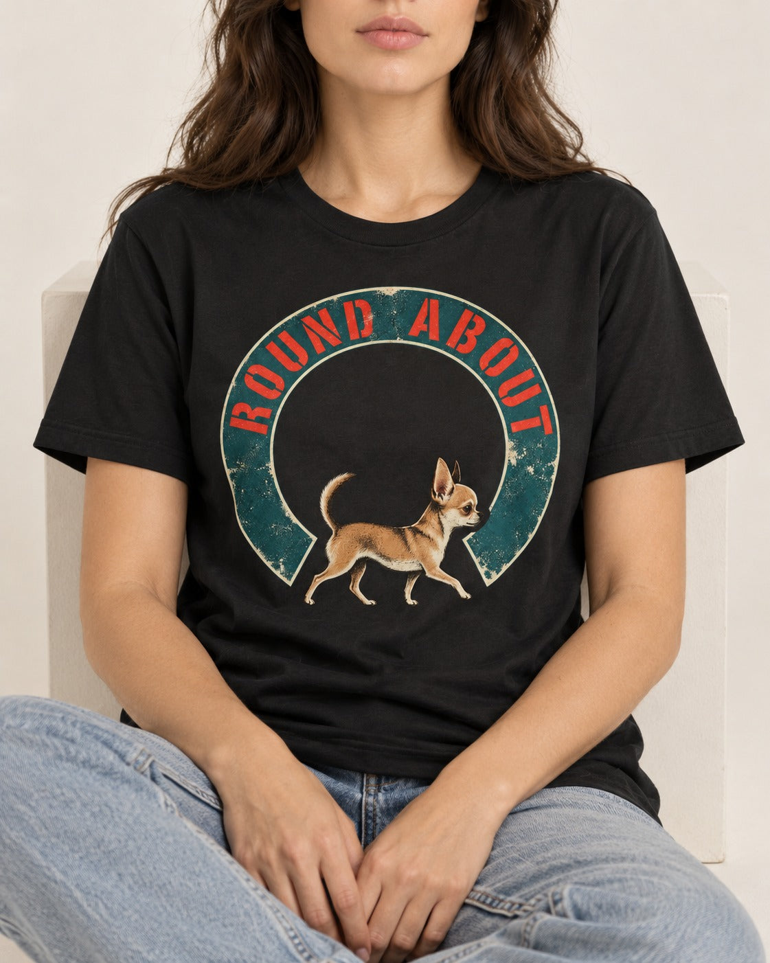 Round About Chihuahua Emblem Graphic T-Shirt in Black, worn by a seated model