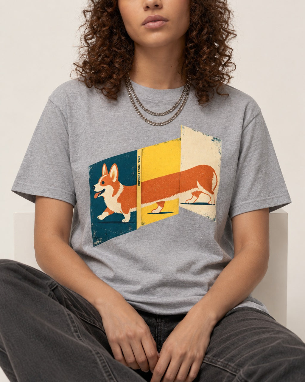 Corgi Back Folds Forward Panels T-Shirt in Sport Grey, worn by a seated model