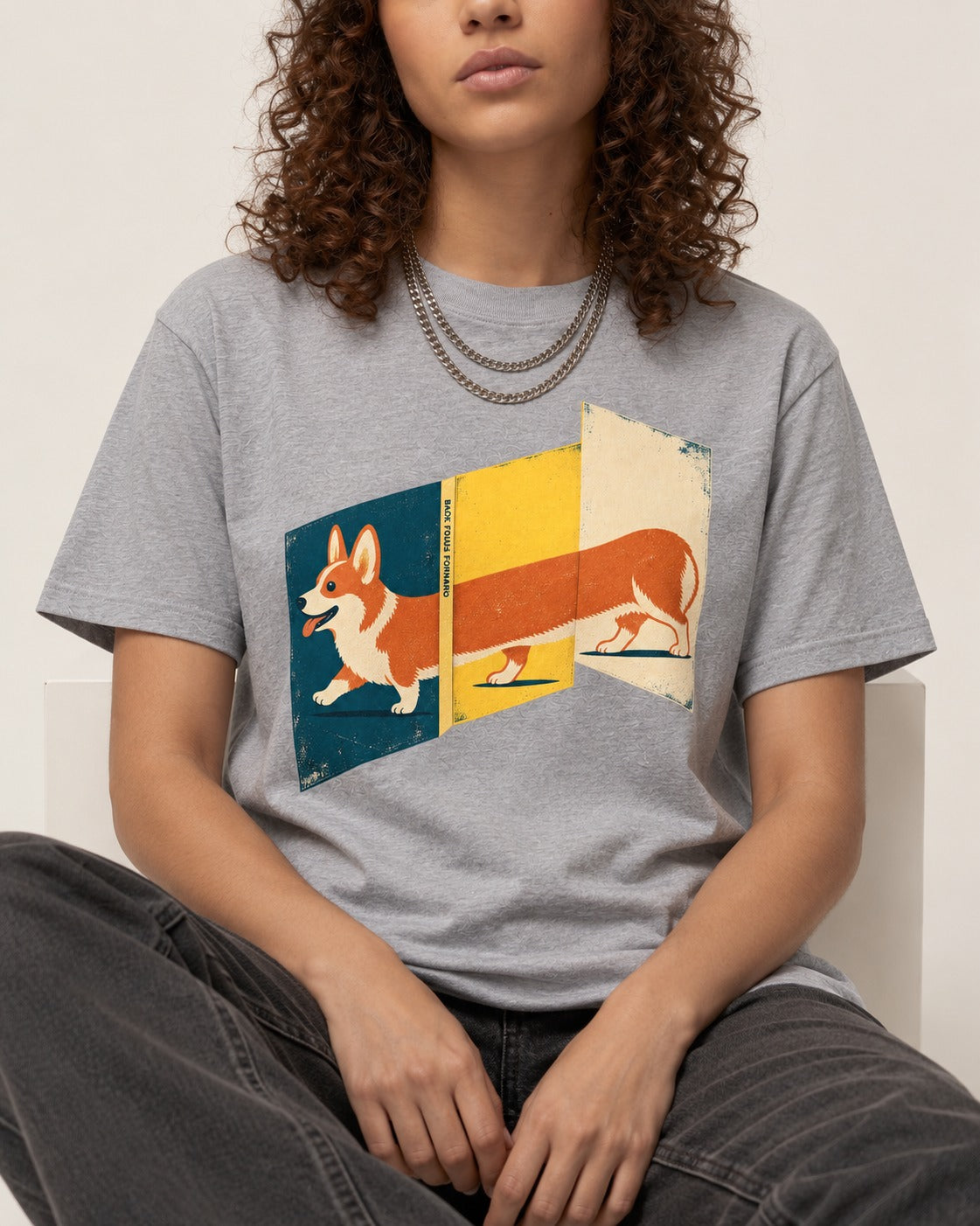 Corgi Back Folds Forward Panels T-Shirt in Sport Grey, worn by a seated model