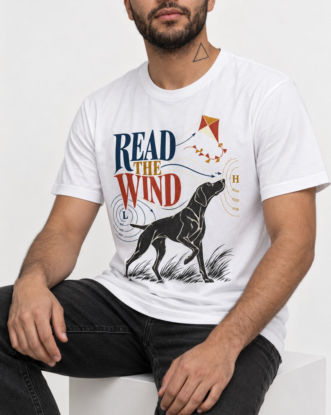 Read the Wind German Shorthaired Pointer T-Shirt in White, worn by a seated model