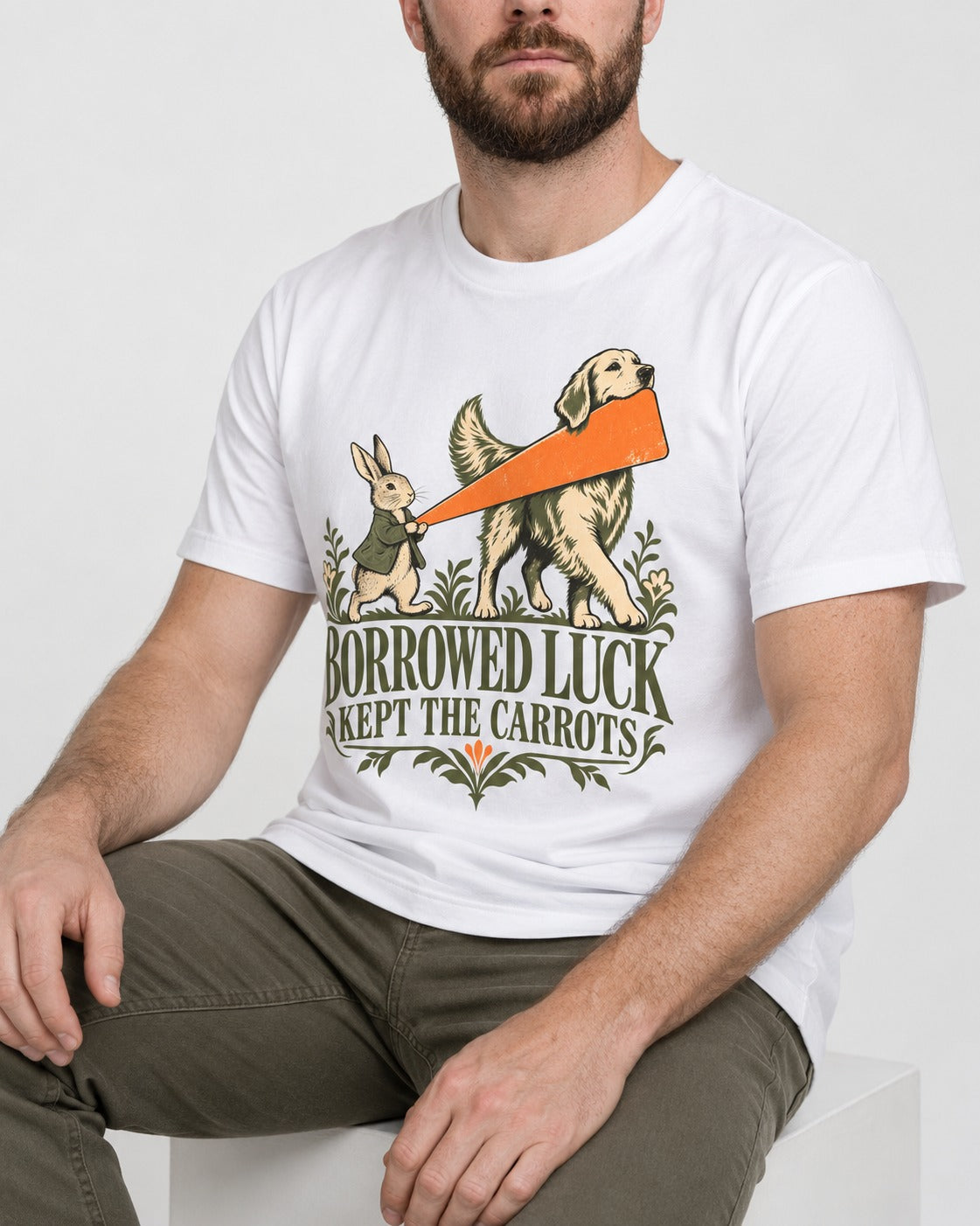 Borrowed Luck Golden Retriever T-Shirt in White, worn by a seated model