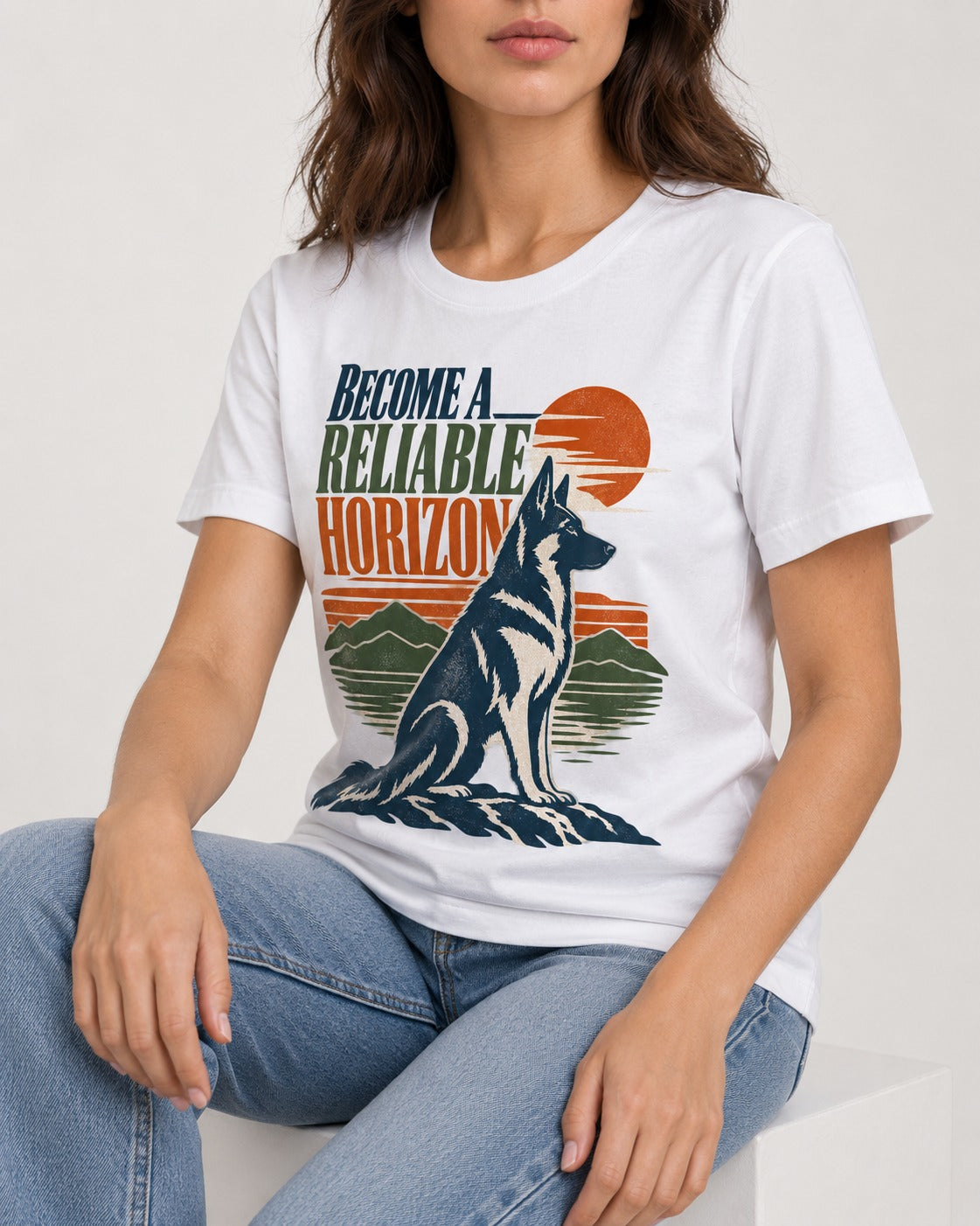 German Shepherd Dog Become a Reliable Horizon T-Shirt in White, worn by a seated model