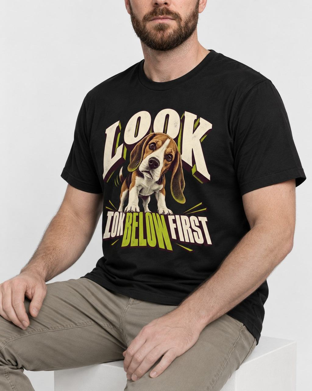 Beagle Look Low Below First T-Shirt in Black, worn by a seated model
