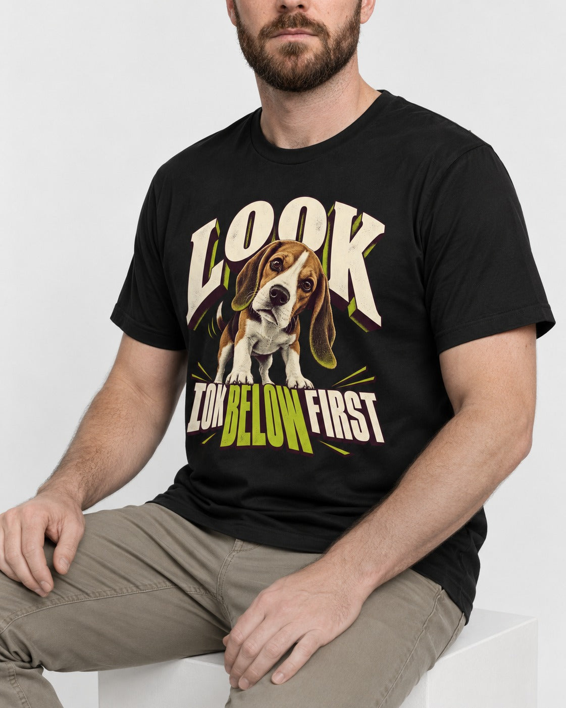 Beagle Look Low Below First T-Shirt in Black, worn by a seated model