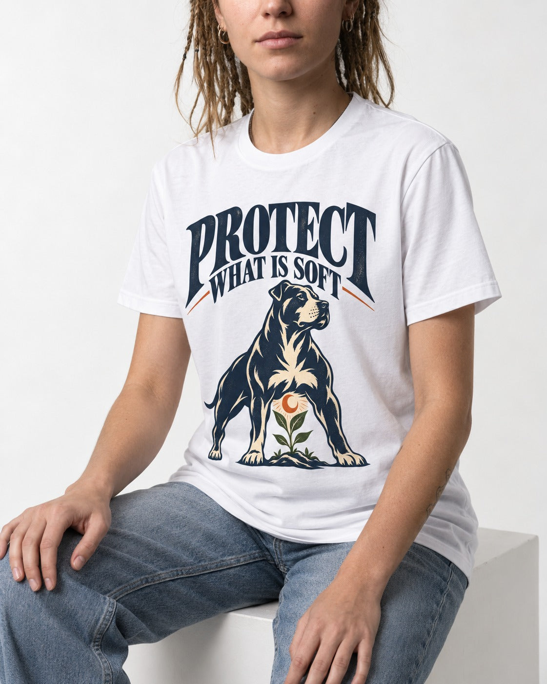Protect What Is Soft Pitbull T-Shirt in White, worn by a seated model