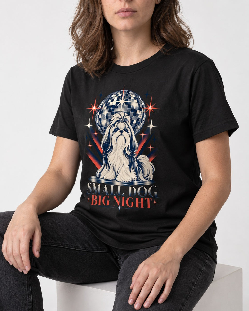Shih Tzu Small Dog Big Night Disco Graphic T-Shirt in Black, worn by a seated model