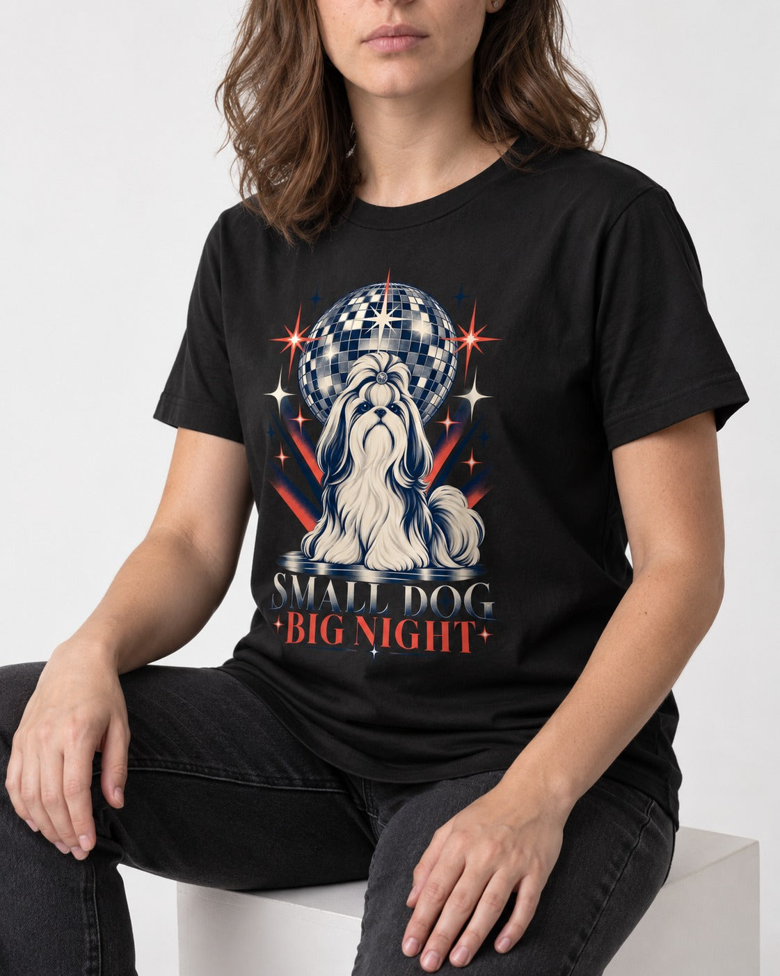 Shih Tzu Small Dog Big Night Disco Graphic T-Shirt in Black, worn by a seated model