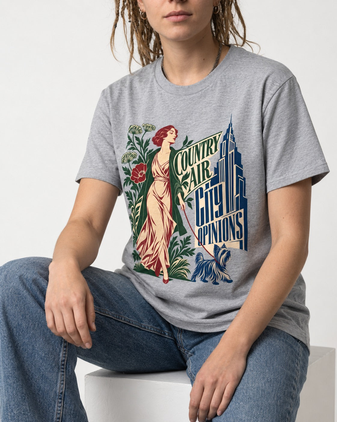 Yorkshire Terrier Country Air City Opinions Botanical Graphic T-Shirt in Sport Grey, worn by a seated model