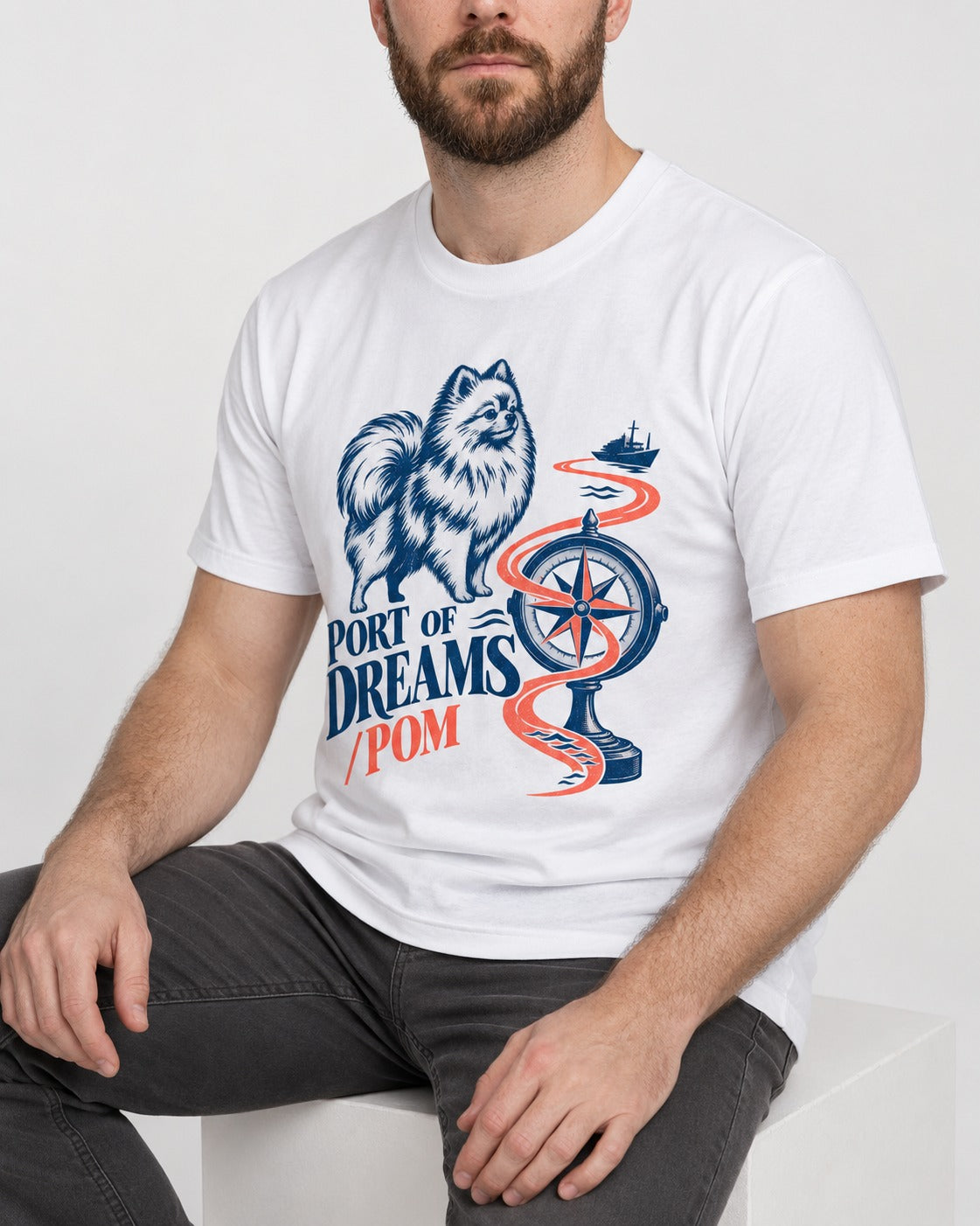 Pomeranian Port of Dreams T-Shirt in White, worn by a seated model