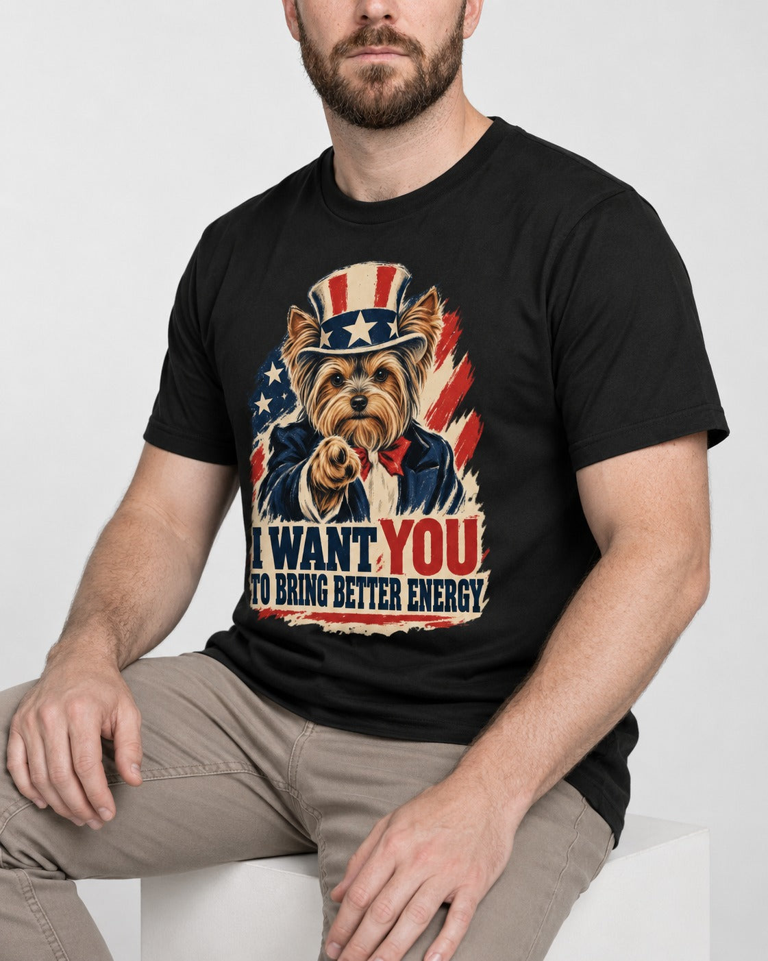 Yorkshire Terrier I Want You to Bring Better Energy Recruitment Poster Graphic T-Shirt in Black, worn by a seated model