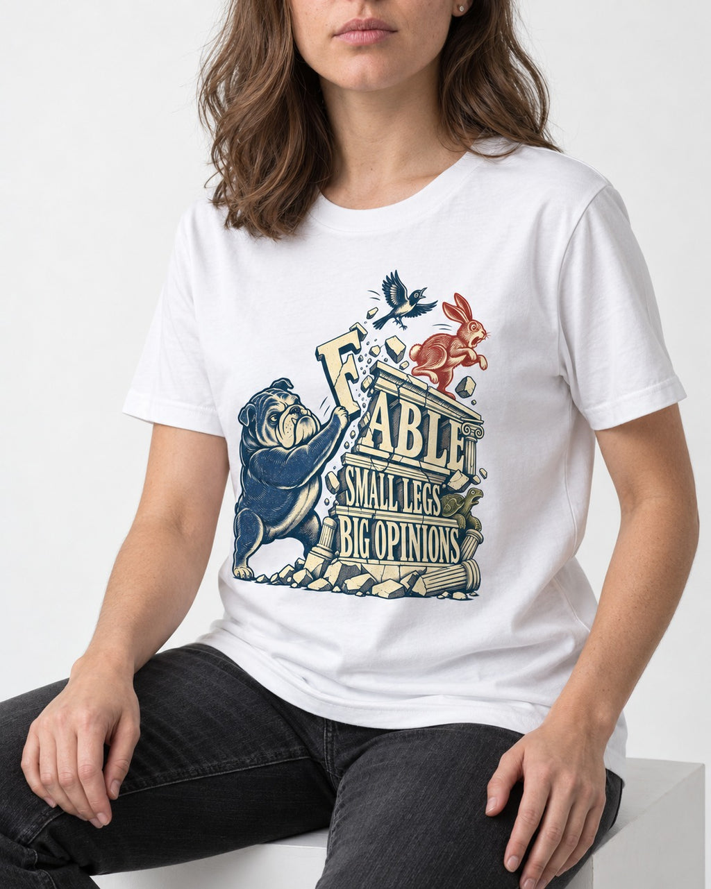 Small Legs Big Opinions English Bulldog T-Shirt in White, worn by a seated model