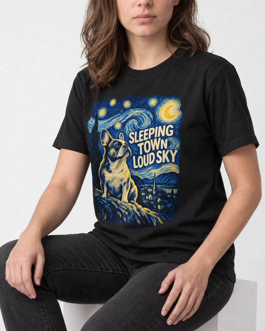 Frenchie Sleeping Town Loud Sky Graphic T-Shirt in Black, worn by a seated model