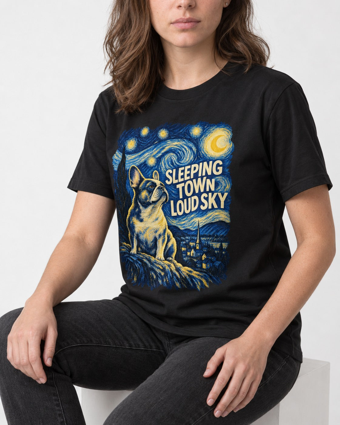 Frenchie Sleeping Town Loud Sky Graphic T-Shirt in Black, worn by a seated model